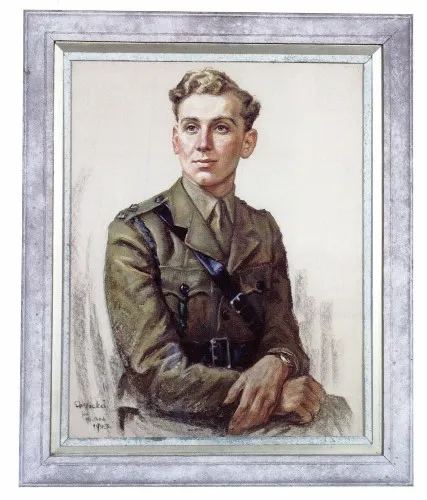 Portrait of a young man in military uniform, seated with hands crossed, framed in a silver frame.